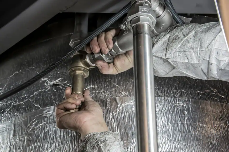 Hands on a shut-off valve
