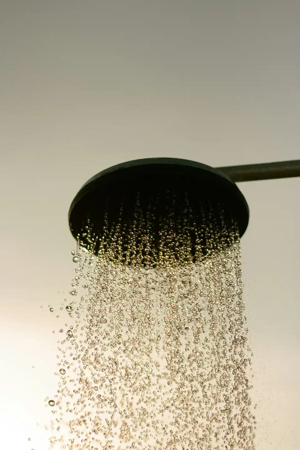 A shower head running hot